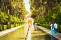 Yazd, Iran - 10th june, 2022: muslim tourist couple visit famous sightseeing attraction Dowlat Abad Garden , Yazd , Iran