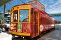 Colorful streetcar on cloudy sky background. Royalty Free Stock Photo