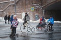 Cyclist rides on special bike along the Kremlin walls in winter.