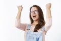 Yeah baby we did it. Portrait of relieved and thankful happy woman celebrating victory, triumphing yelling yes with Royalty Free Stock Photo