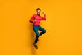 Yeah. Full body photo of funny crazy guy jump high up celebrating lottery money winning wear trendy red shirt bow tie Royalty Free Stock Photo