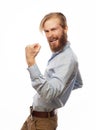 Yeah. Happy winner. Young handsome bearded man gesturing and keeping mouth open. Royalty Free Stock Photo