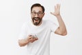 Yeah I did it. Portrait of excited happy and joyful grandad in glasses with beard, raising palm in joy and victory pose