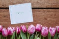 Yeah spring message tulips on wood Royalty Free Stock Photo