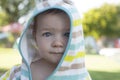 1 year baby boy with hooded poncho towel after swimming