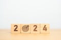 2024 year block with dartboard icon. Goal, Target, Resolution, strategy, plan, Action, mission, motivation, and New Year start