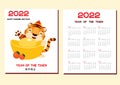 2022 year calendar with tiger. Chinese new year design with symbol of lunar zodiac, tiger with golden boat yuanbao ingot