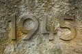 Year 1945 carved in the stone. Years of World War II.