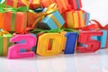 2015 year colorful figures on the background of gifts Royalty Free Stock Photo