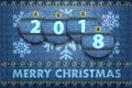 2018 year digits and Merry Christmas greetings on blue jeans background Royalty Free Stock Photo