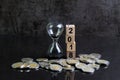 Year 2018 financial or investment time or goals concept with hourglass or sandglass and stack of coins and cube block with number