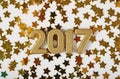 2017 year golden figures and golden stars on a white Royalty Free Stock Photo