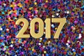 2017 year golden figures and varicolored confetti Royalty Free Stock Photo