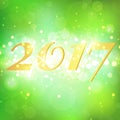 Year 2017 on green bokeh abstract background Royalty Free Stock Photo