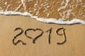 2019 year and heart written on sandy beach sea. Royalty Free Stock Photo