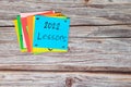 Year 2022 life lessons and learnings concept. Sticky notes in blue background.