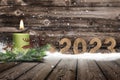 Year 2023 made of wood in snow Royalty Free Stock Photo