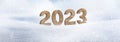 Year 2023 made of wood in snow Royalty Free Stock Photo