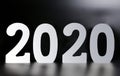 Year 2020 made from wooden white numbers on a black background