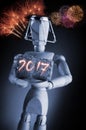 Year 2016, manikin mannequin human artist drawing model holding a wine cork on black background with fireworks. Royalty Free Stock Photo