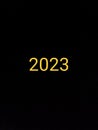 year 2023 number colorful on black background ,yellow