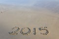 Year 2015 number written on sandy beach. Royalty Free Stock Photo