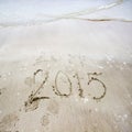 Year 2015 number written on sandy beach/New year 2015 background Royalty Free Stock Photo