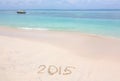Year 2015 number written on sandy beach Royalty Free Stock Photo