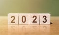 2023 year numbers on wood dices on green background. New years concept Royalty Free Stock Photo