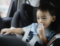 1 Year Old Adorable Asian Boy Alone Looking Around From Car Seat in the Car