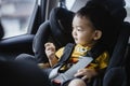 1 Year Old Adorable Asian Boy Alone Looking Around From Car Seat in the Car Royalty Free Stock Photo