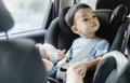 1 Year Old Adorable Asian Boy Alone Looking Around From Car Seat in the Car Royalty Free Stock Photo