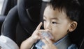 1 Year Old Adorable Asian Boy Alone Looking Around From Car Seat in the Car Royalty Free Stock Photo