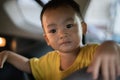 1 Year Old Adorable Asian Boy Playing and Looking Around in the Car Royalty Free Stock Photo