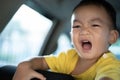 1 Year Old Adorable Asian Boy Shouting Crying Alone Around in the Car Royalty Free Stock Photo