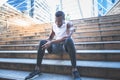 African American man with black skin he is and athlete, currently having a knee injury After he exercised by running Royalty Free Stock Photo