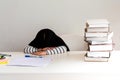 A 6 year old Asian girl, Are falling asleep While doing homework Royalty Free Stock Photo