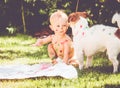 1 year old baby painting on his body and on dog