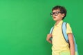 7-year-old boy with backpack on his back, looking into distance Royalty Free Stock Photo