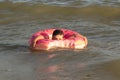 5 year old boy bathes in the sea in a life ring on a sunny day Royalty Free Stock Photo