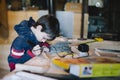 10-year-old boy in a carpenter`s workshop learns how to do small