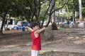 10 year old Brazilian child playing with his Styrofoam plane on a sunny afternoon_2