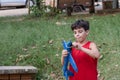10 year old Brazilian child playing with his Styrofoam plane on a sunny afternoon_18