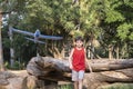 10 year old Brazilian child playing with his Styrofoam plane on a sunny afternoon_8