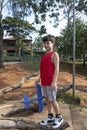 10 year old Brazilian child playing with his Styrofoam plane on a sunny afternoon_1