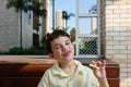 7 year old Brazilian child, smiling and holding a white chocolat Royalty Free Stock Photo