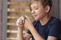 An 11 year old Catholic boy reads the rosary prayer Royalty Free Stock Photo