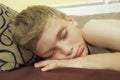 10 year old Caucasian boy fell asleep on the couch. Children& x27;s dream. Sleep problems, falling asleep, insomnia