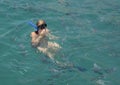 20 year-old Caucasian female tourist enjoying snorkeling in Santa Maria Bay near San Cabo Lucas