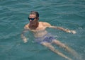 52 year-old Caucasian male tourist enjoying a swim in Santa Maria Bay near San Cabo Lucas.